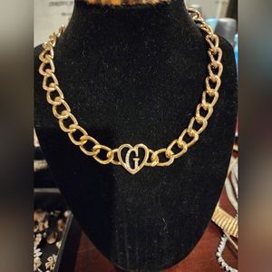 Guess chain necklace with G heart logo.